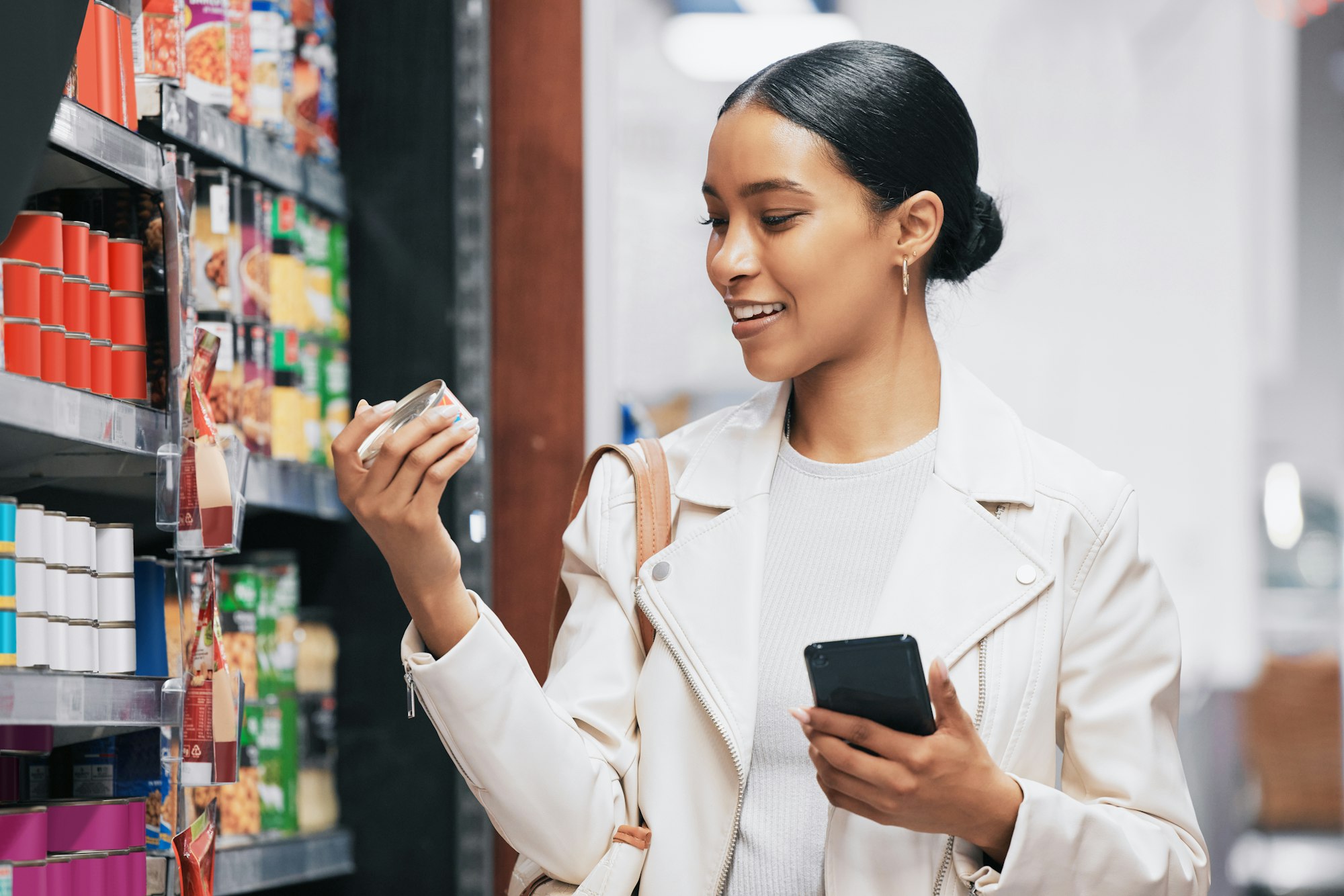 Supermarket, shopping and customer with smartphone check price, label or product information online